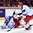 MONTREAL, CANADA - JANUARY 2: Russia's Ziat Paigin #4 clears the puck in front of a diving Igor Shestyorkin #30 during quarterfinal round action at the 2015 IIHF World Junior Championship. (Photo by Richard Wolowicz/HHOF-IIHF Images)